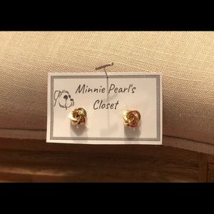 Gold circular earrings.